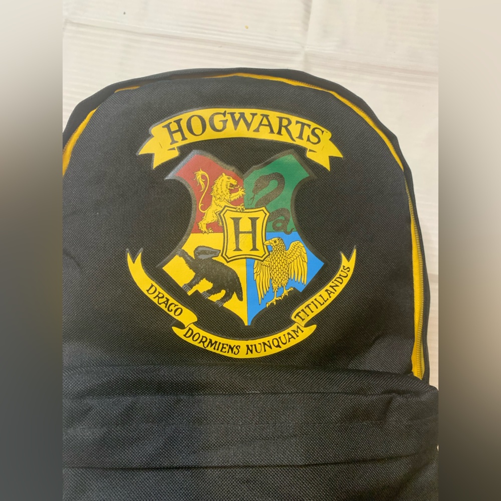 Harry Potter Black and Yellow Backpack. Warner Bros. Good Condition see all Pics